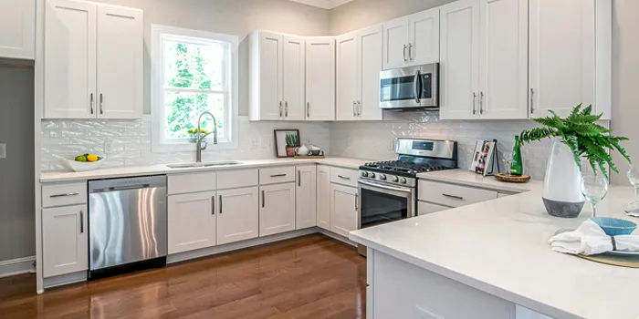 Full kitchen renovation Cambridge with updated cabinets, modern lighting, and a redesigned functional kitchen layout.